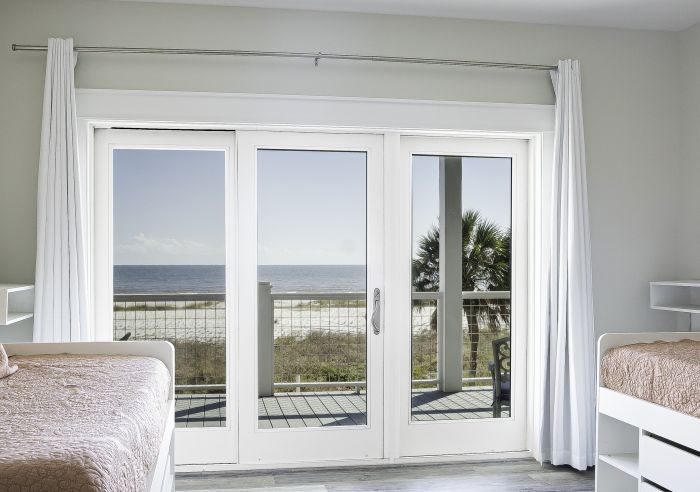 Low-e Full Lite Fiberglass Gliding Triple Door, Impact Rated